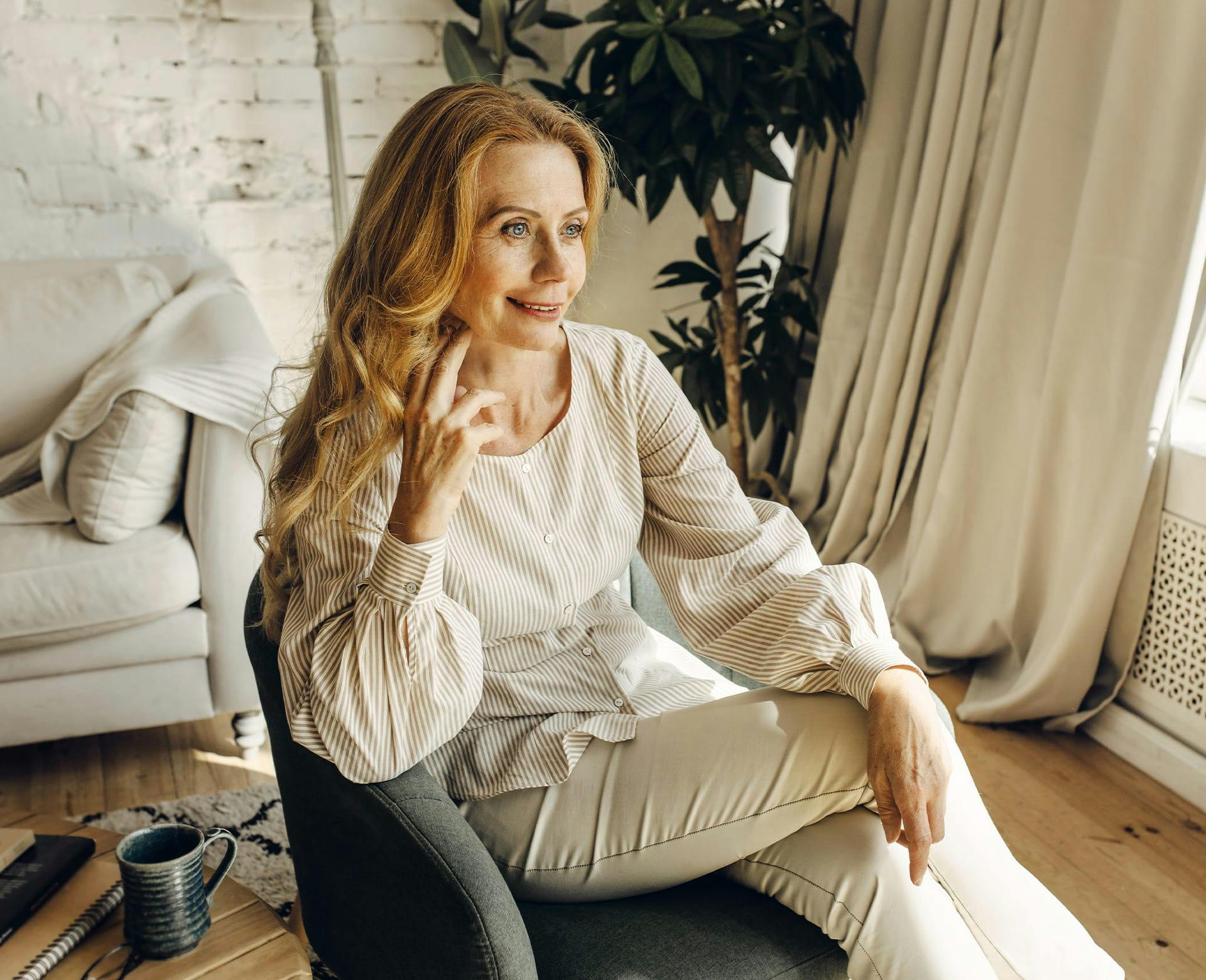 woman sitting in accent chair