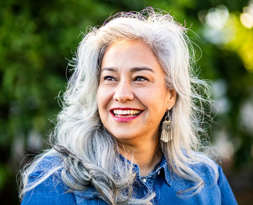 smiling woman with grey hair