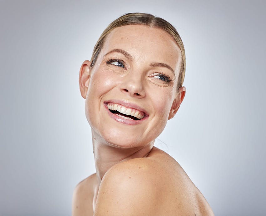 smilling woman with her face turned