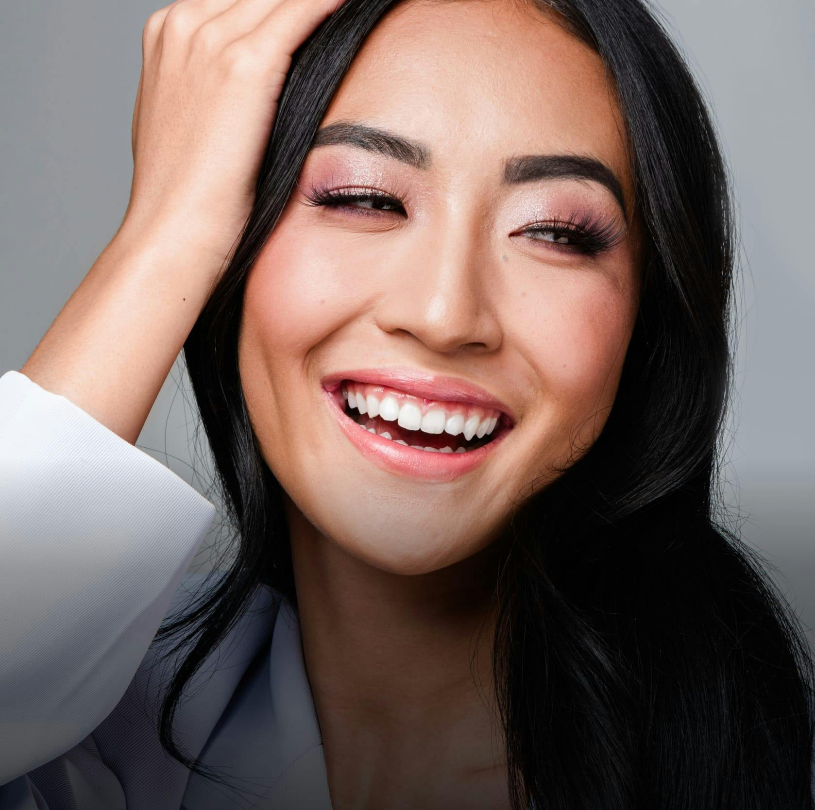 woman smiling and looking to the side