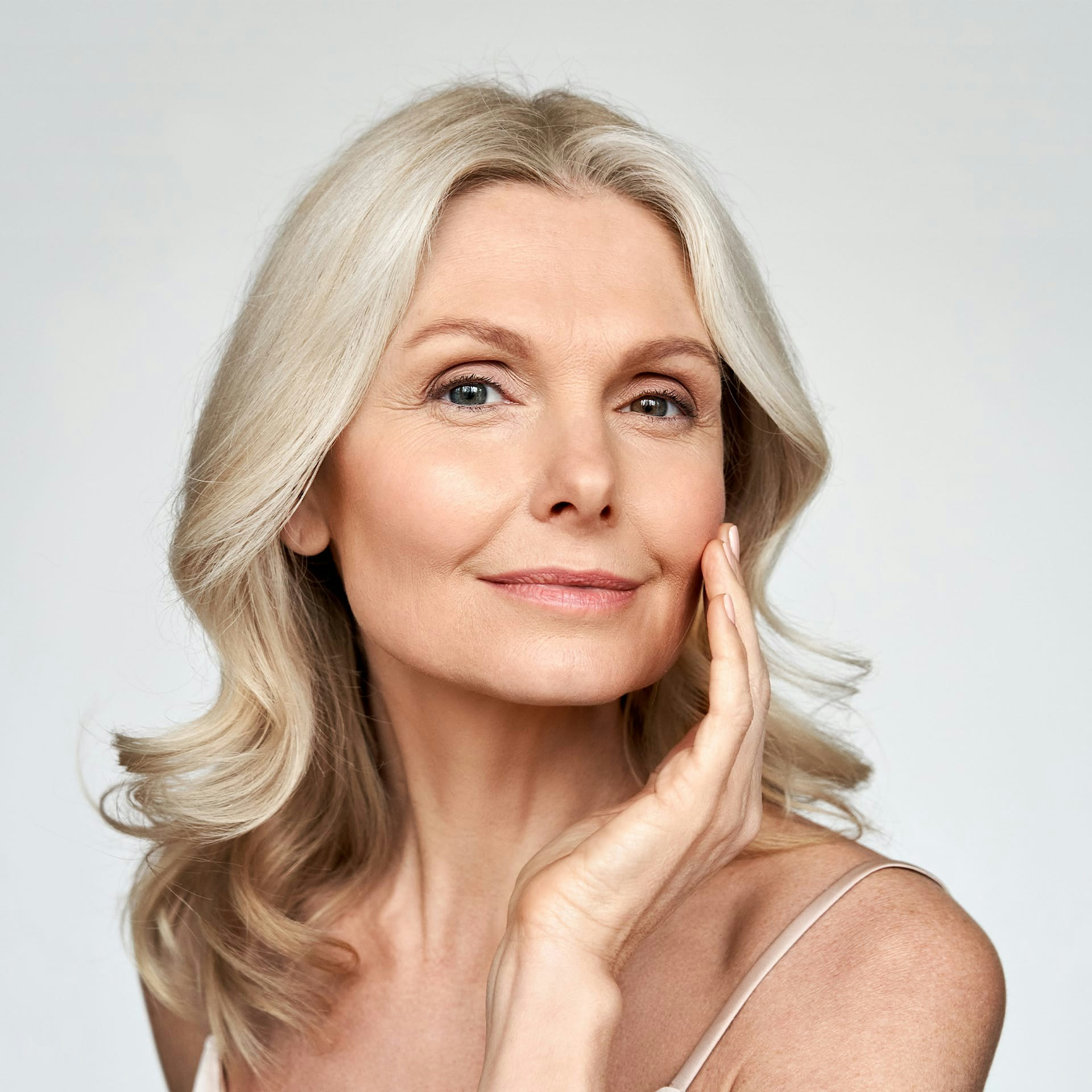 middle aged woman with curly blonde/grey hair