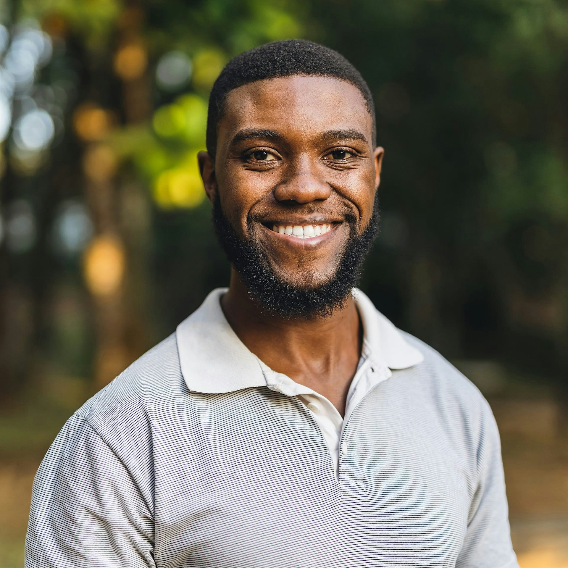 man wearing a striped polo shirt