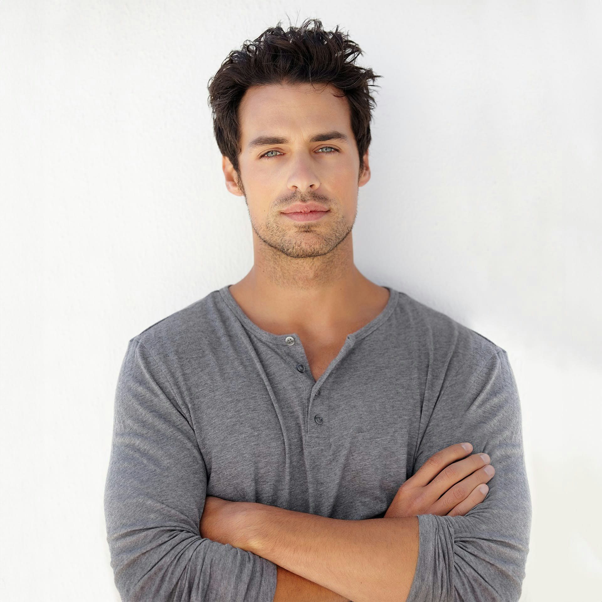 man wearing a grey sweater