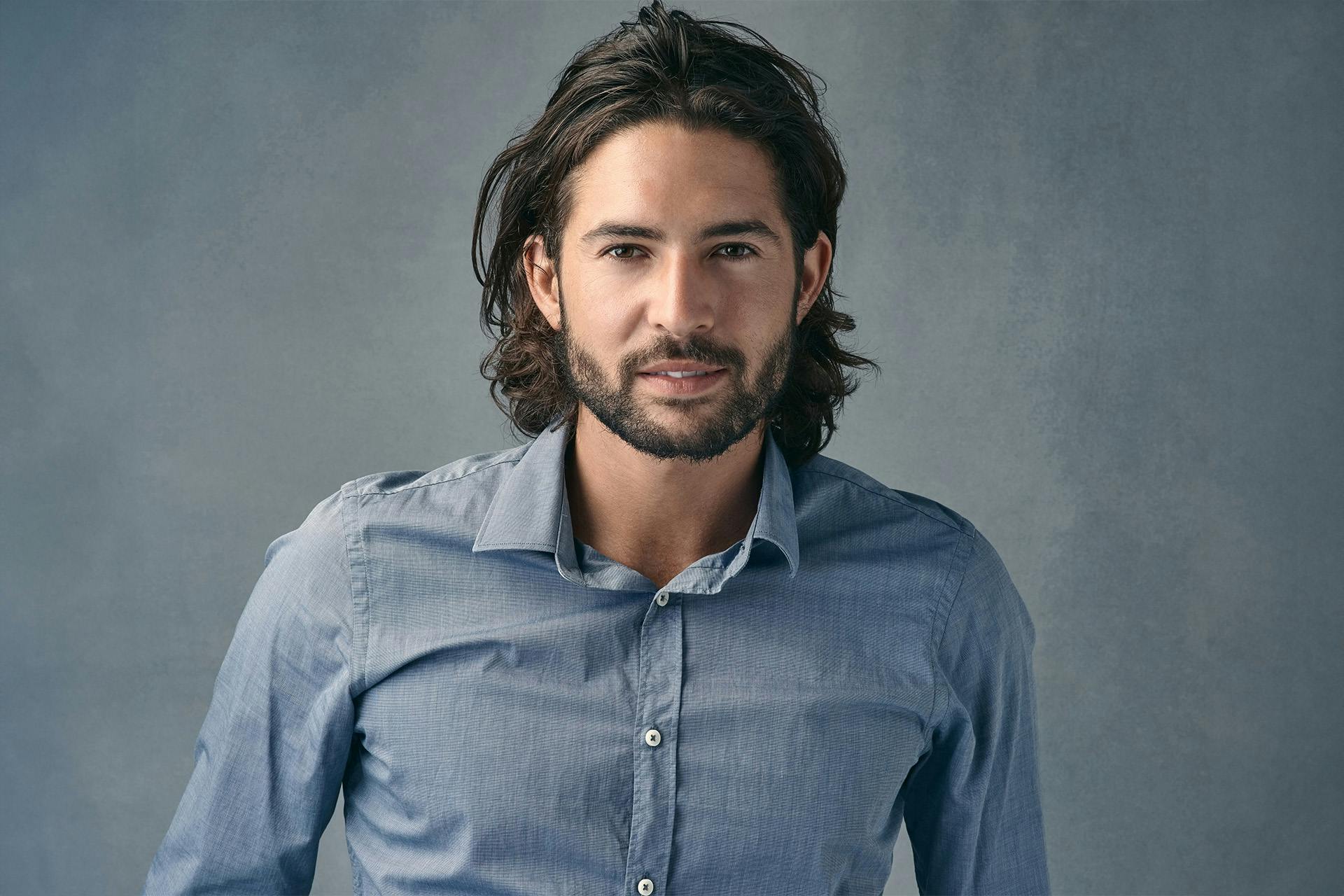handsome man with long black hair