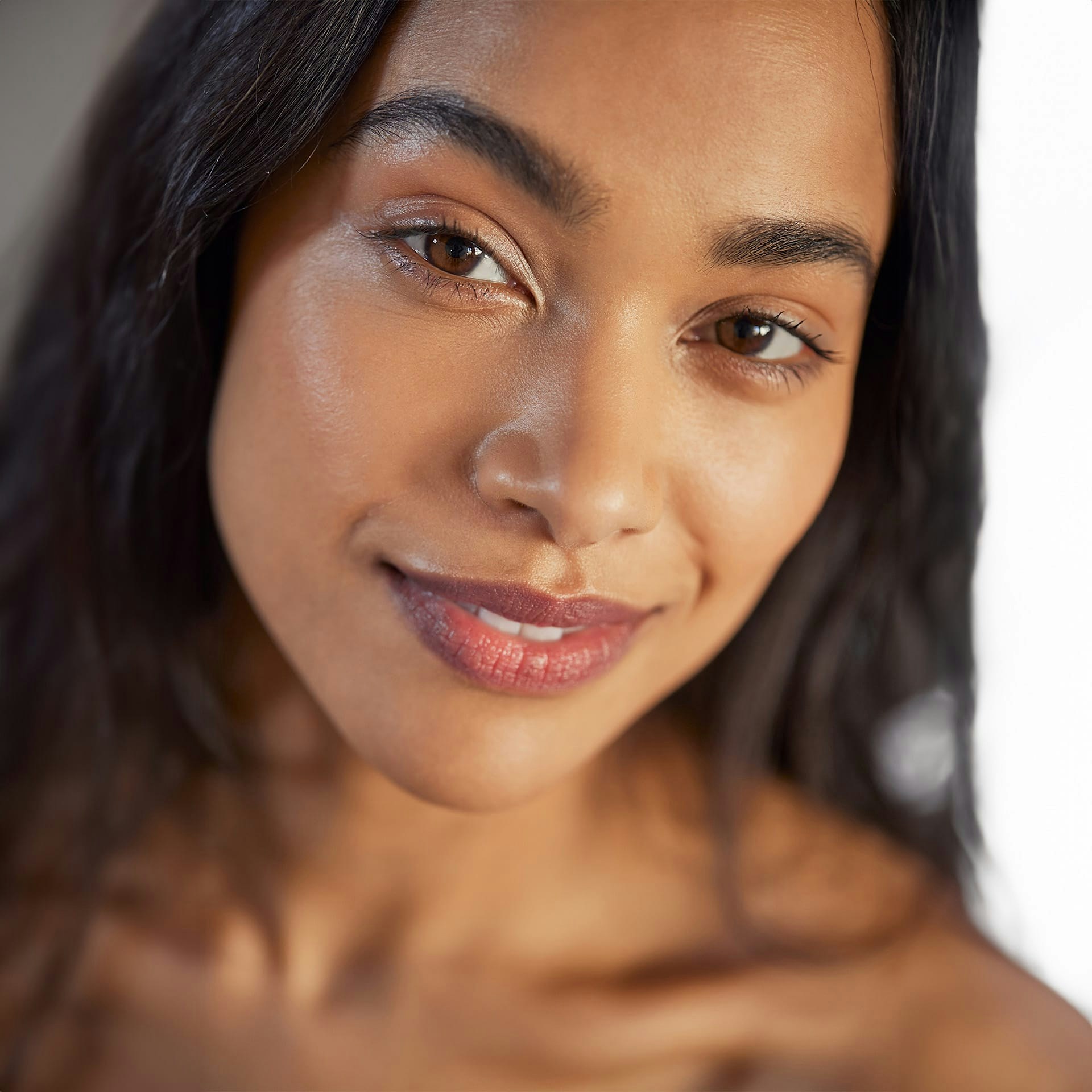 woman with dark hair smiling