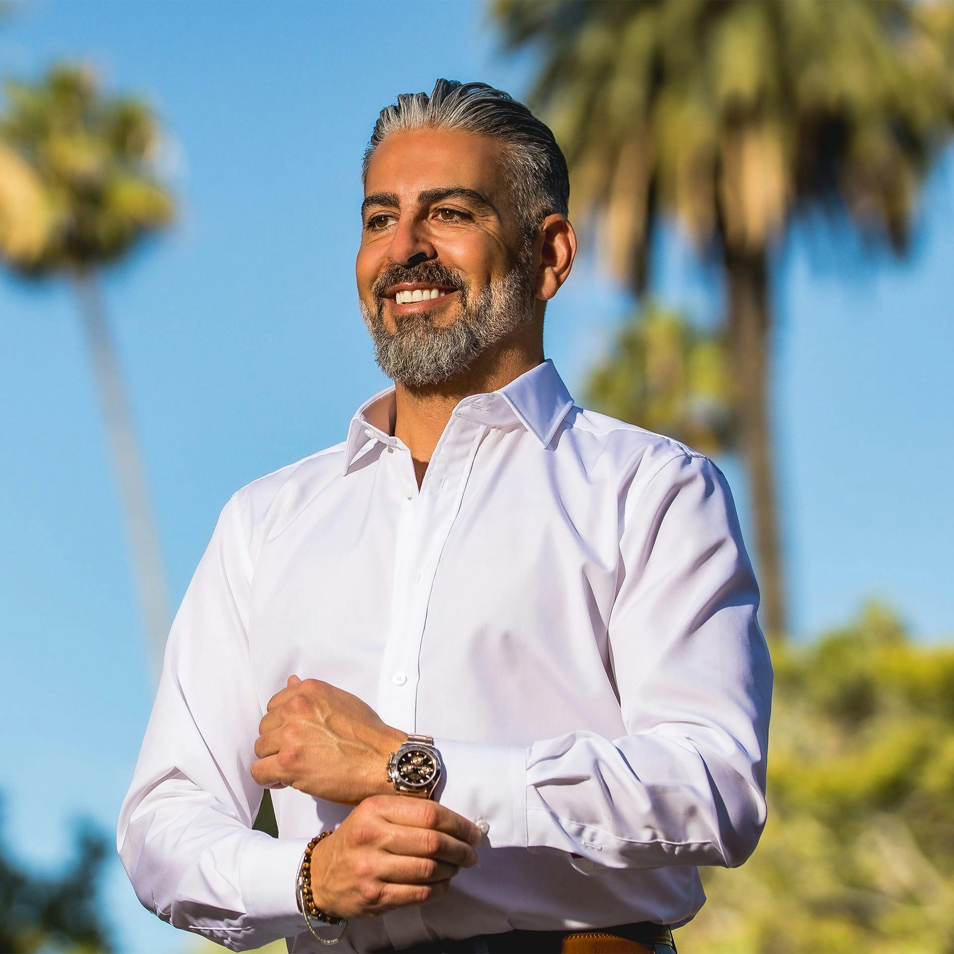 Dr. Firouz smiling outside