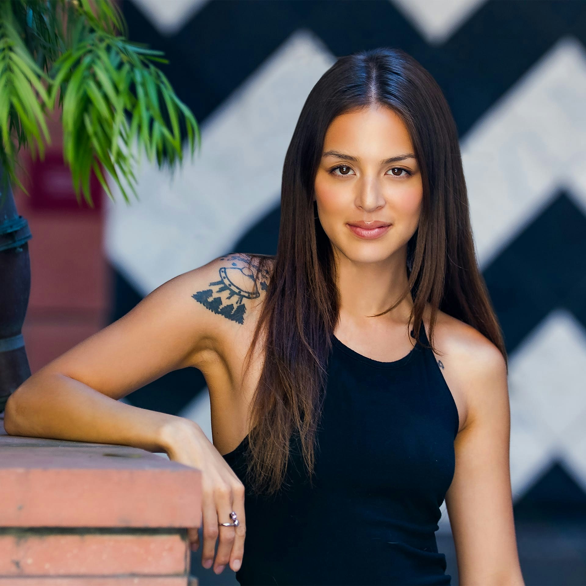 woman in a black tank top