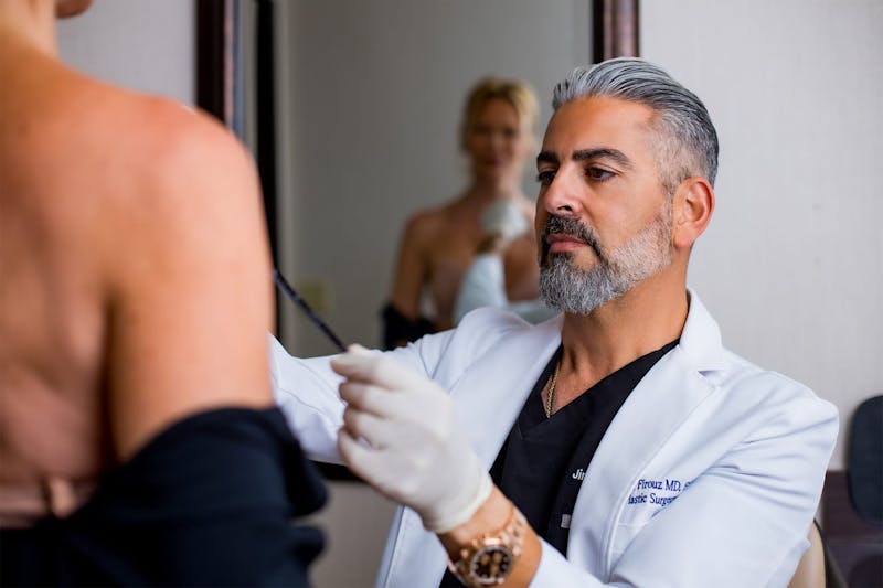 Dr. Firouz with a female patient