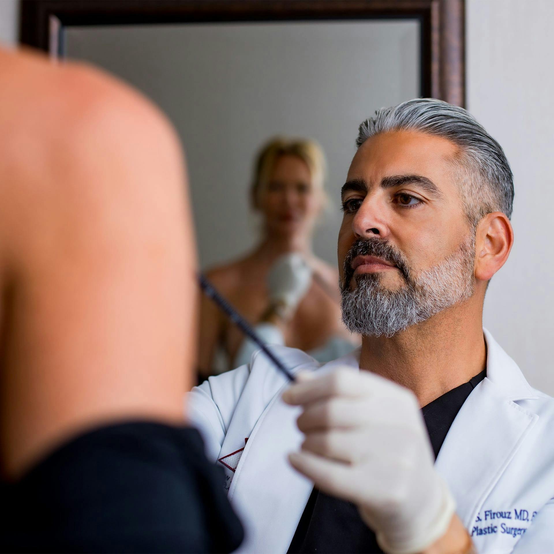 Dr. Firouz with a female patient