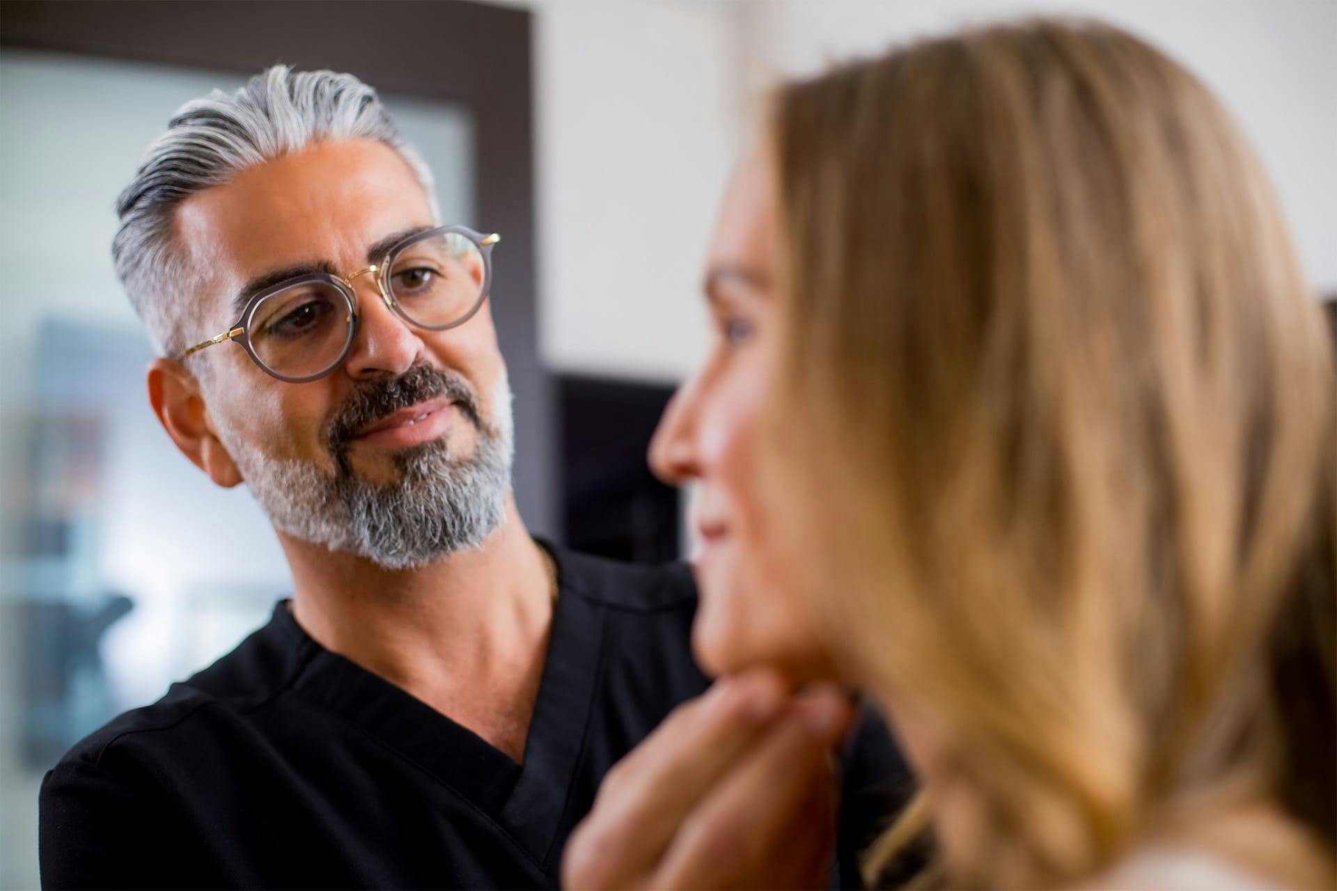Dr. Firouz with a female patient
