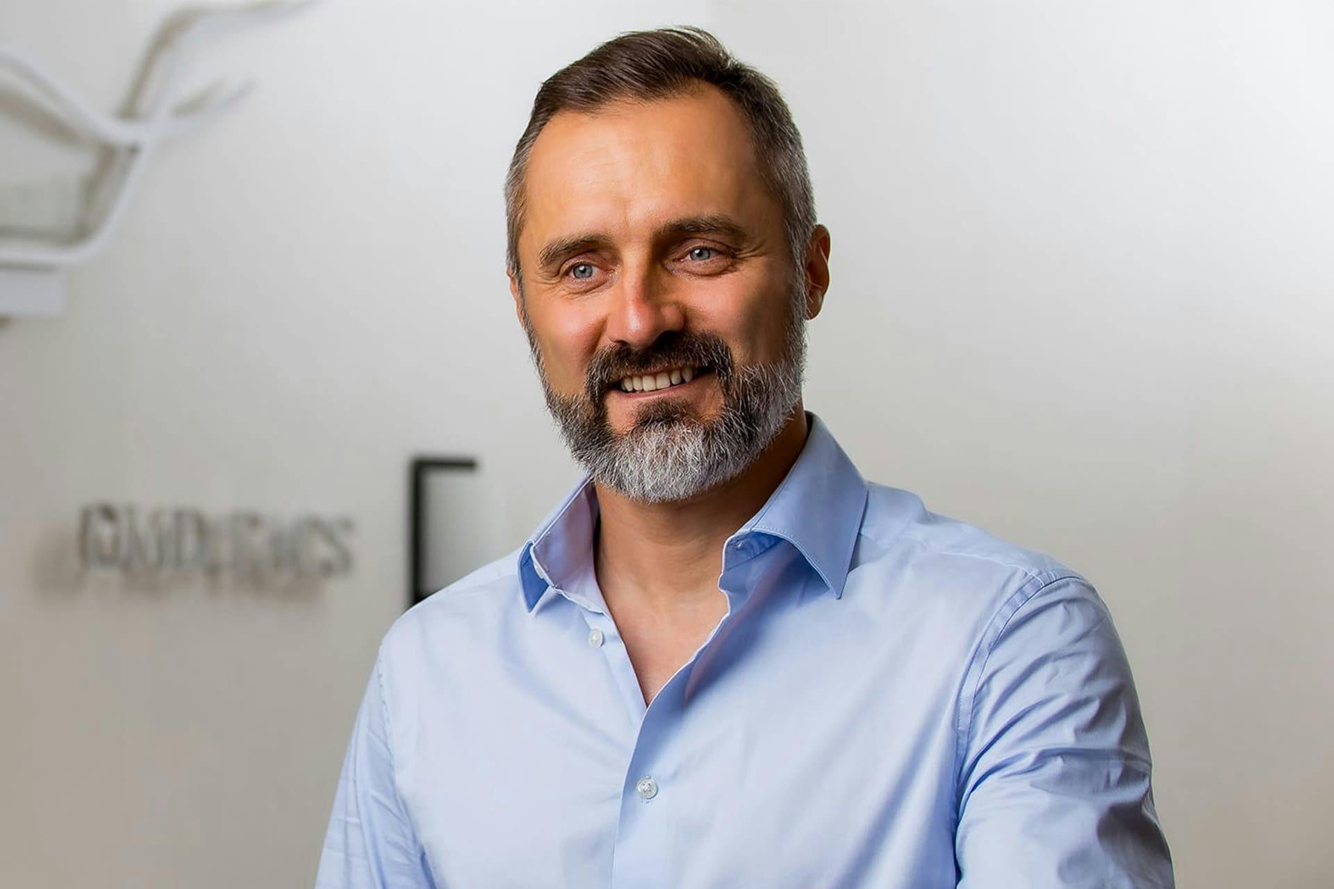man in a blue button up shirt