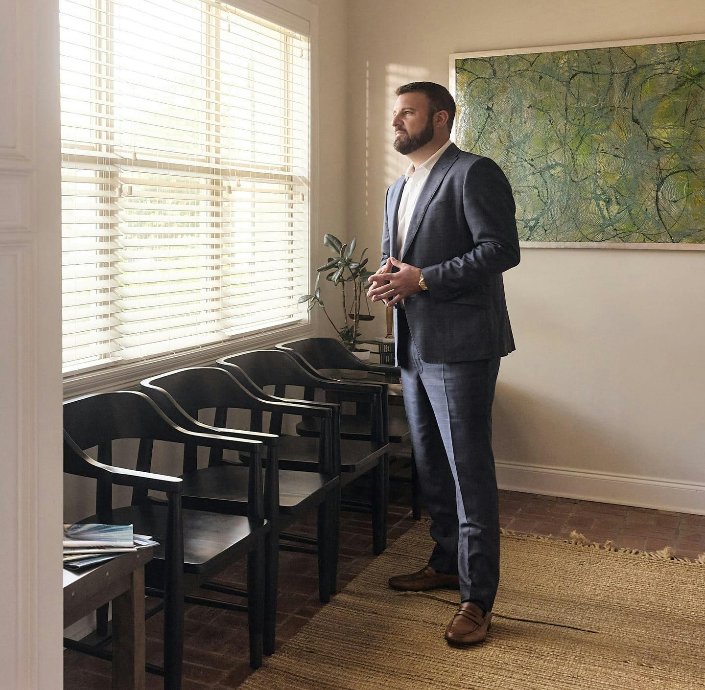 attorney looking out a window