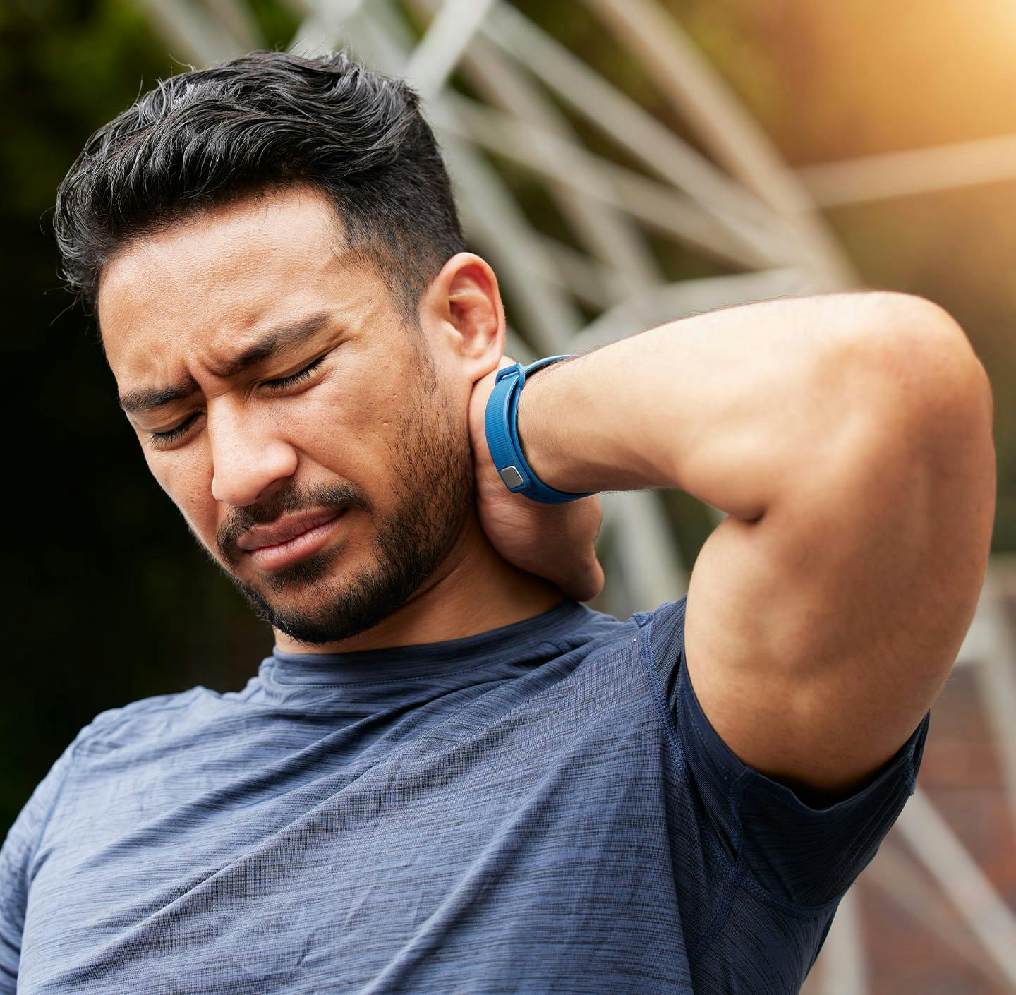 Man holding his neck in pain