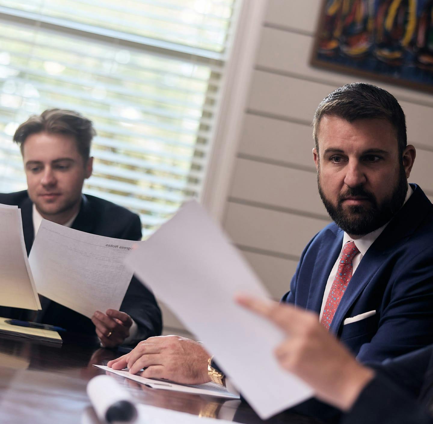 Maggio Law team reviewing case