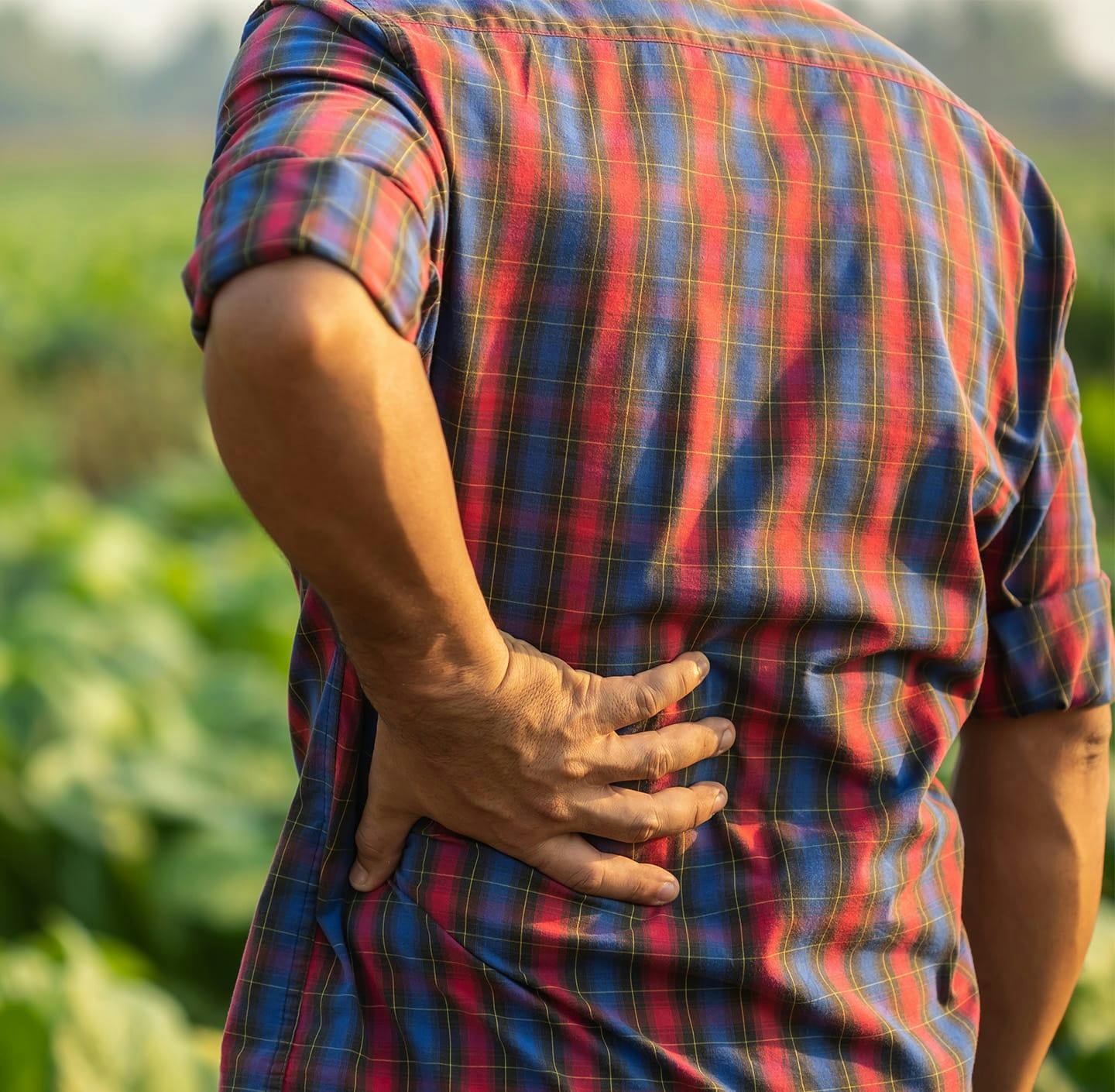 Man holding his lower back