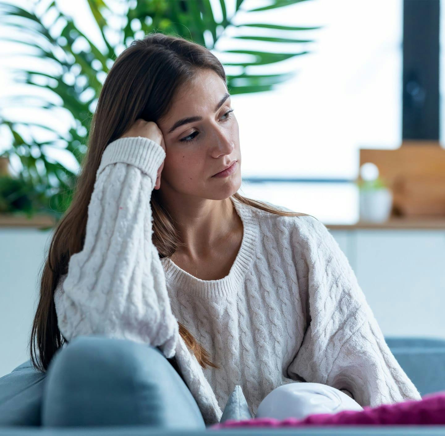 Woman resting her head on her fist