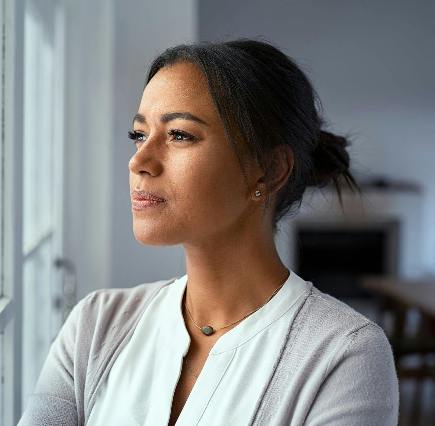 Woman staring out window
