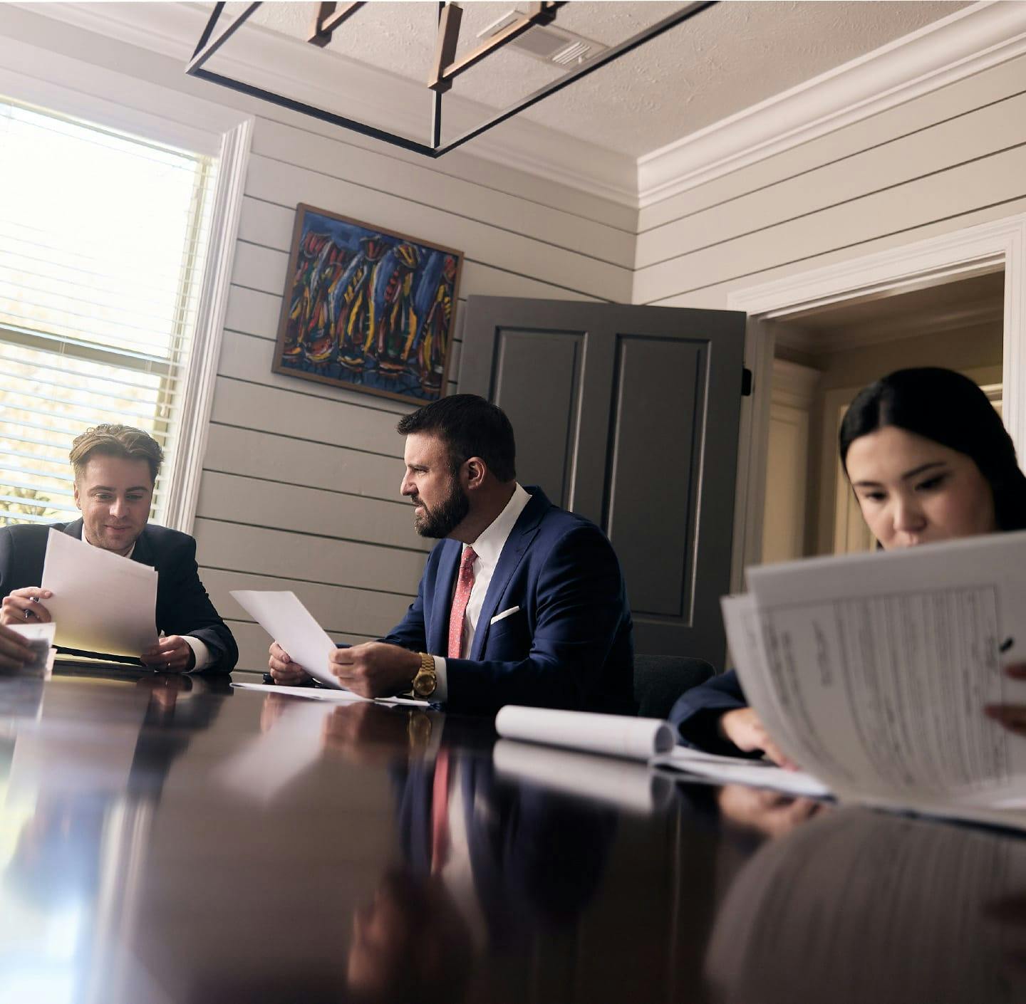 Maggio Law team reviewing documents