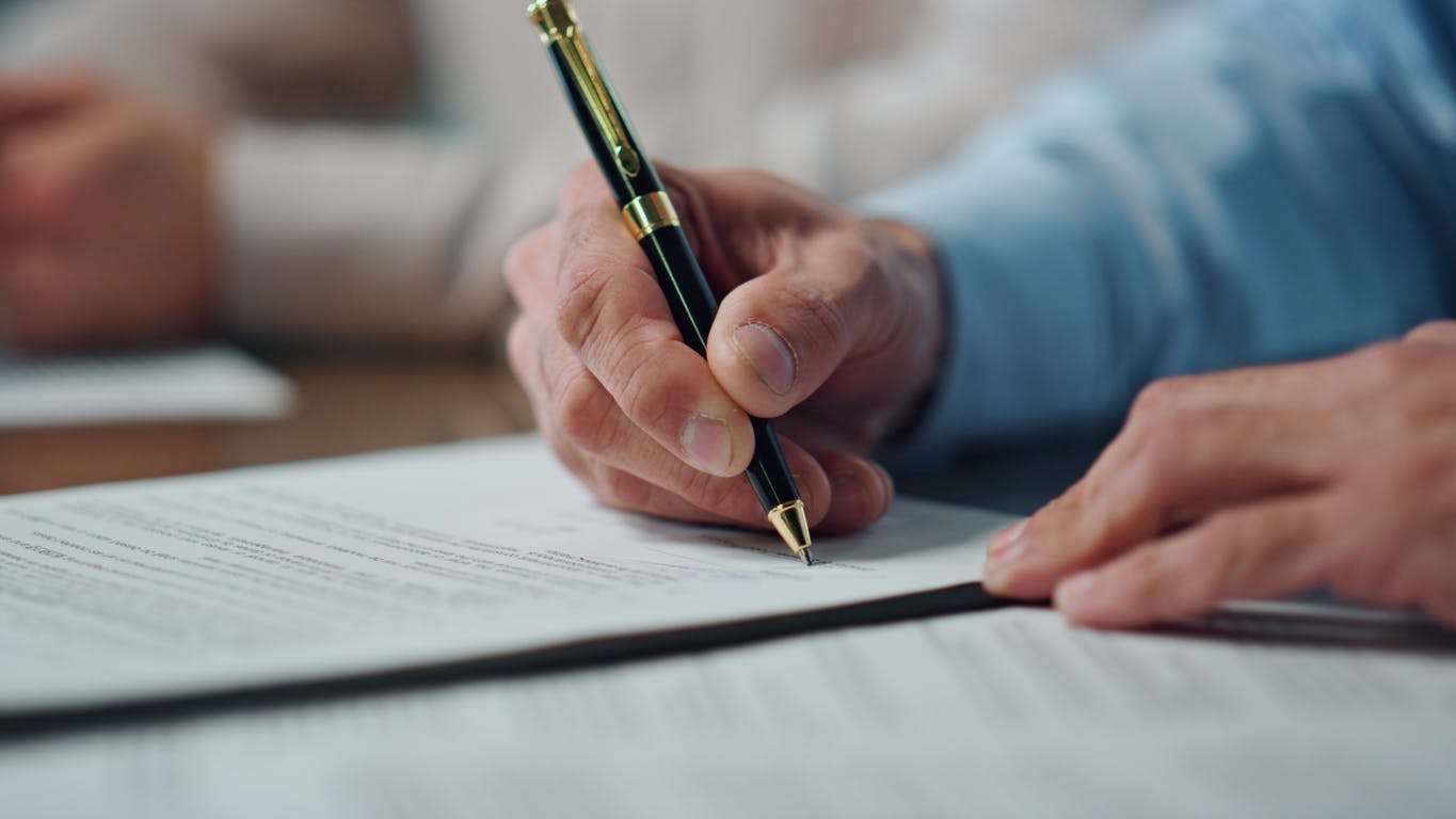Person signing papers