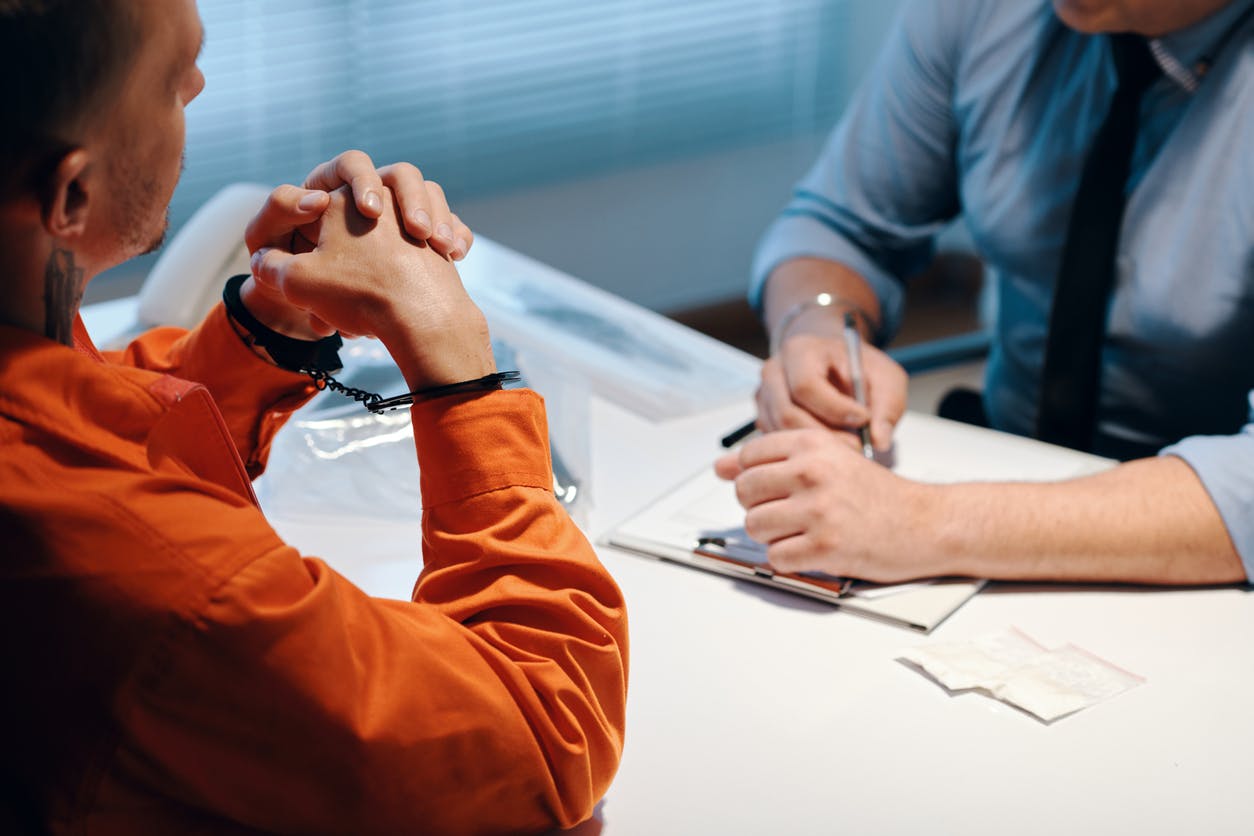 Prisoner speaking to lawyer