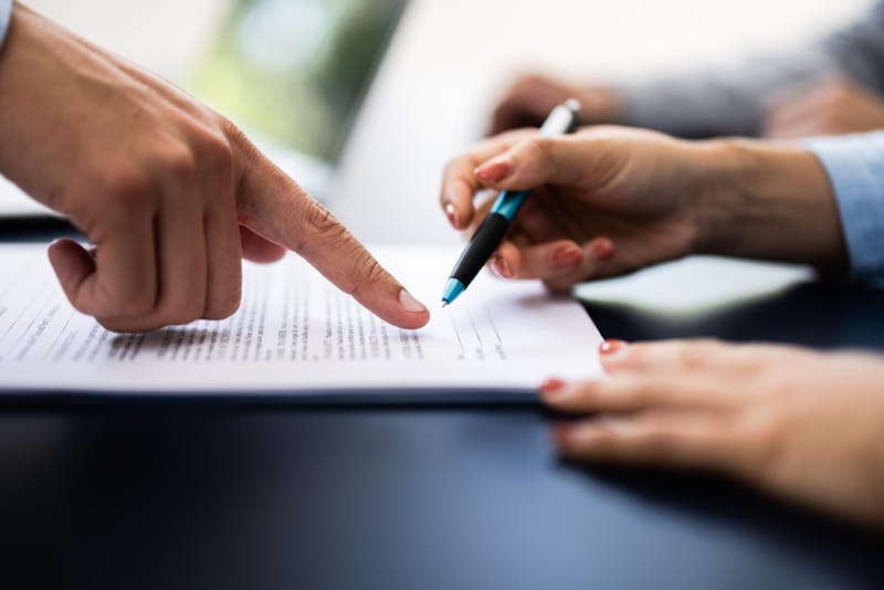 A man pointing to a document