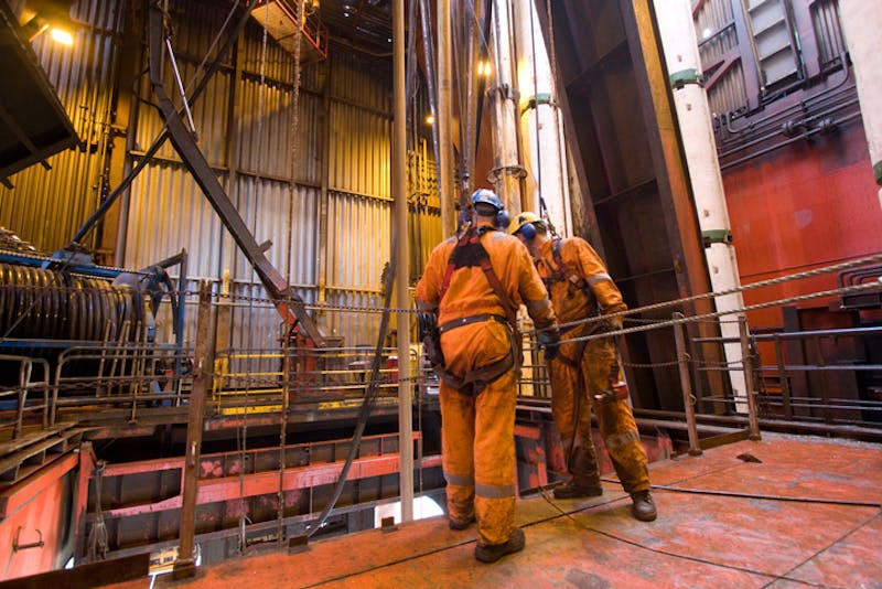 Workers at an off-shore oil rig