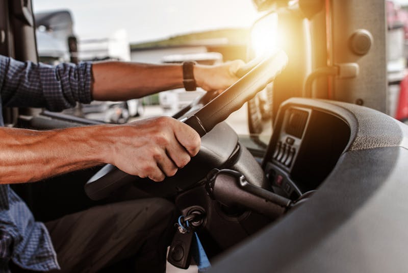 A man driving a truck