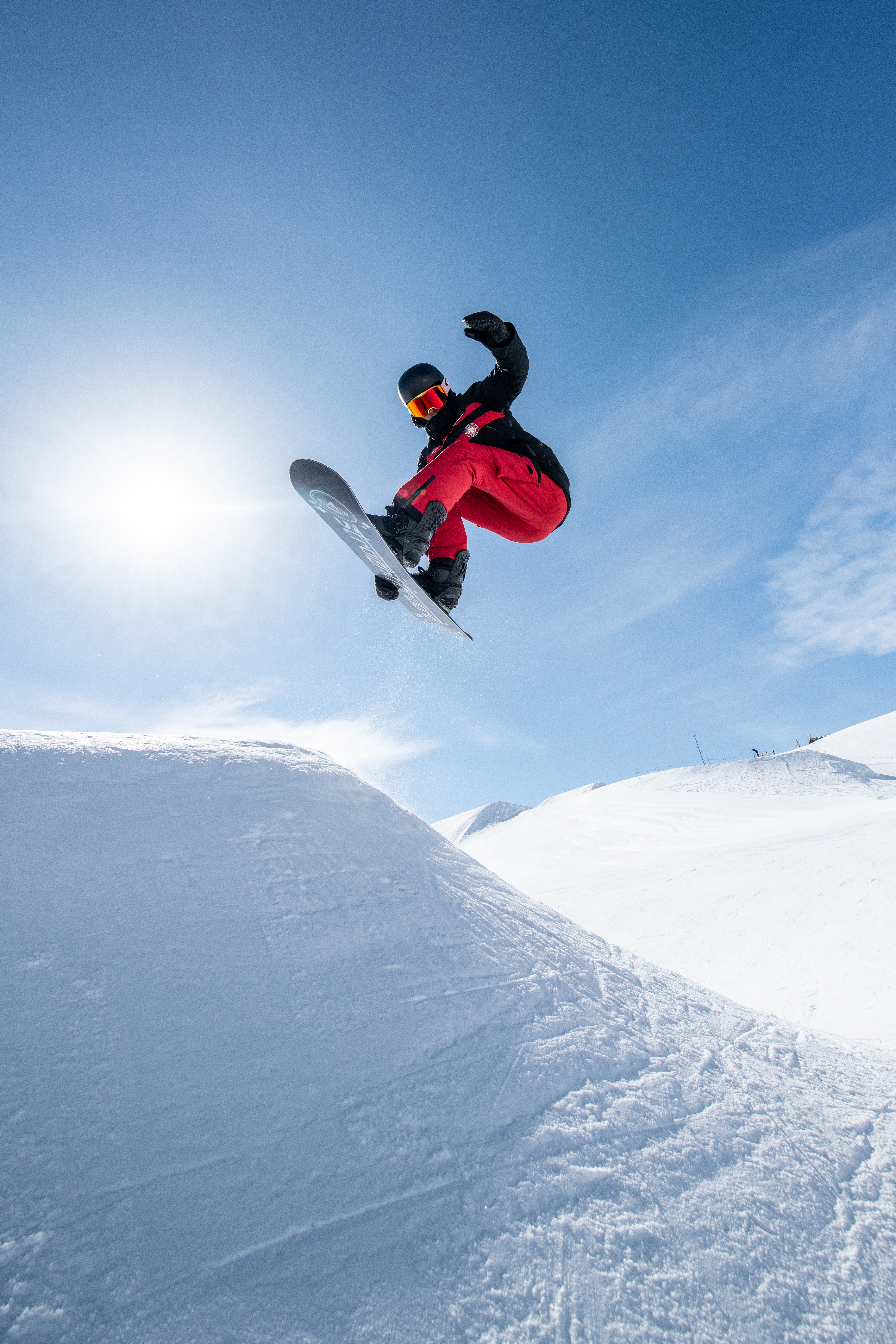Snowboarder jumping on slope