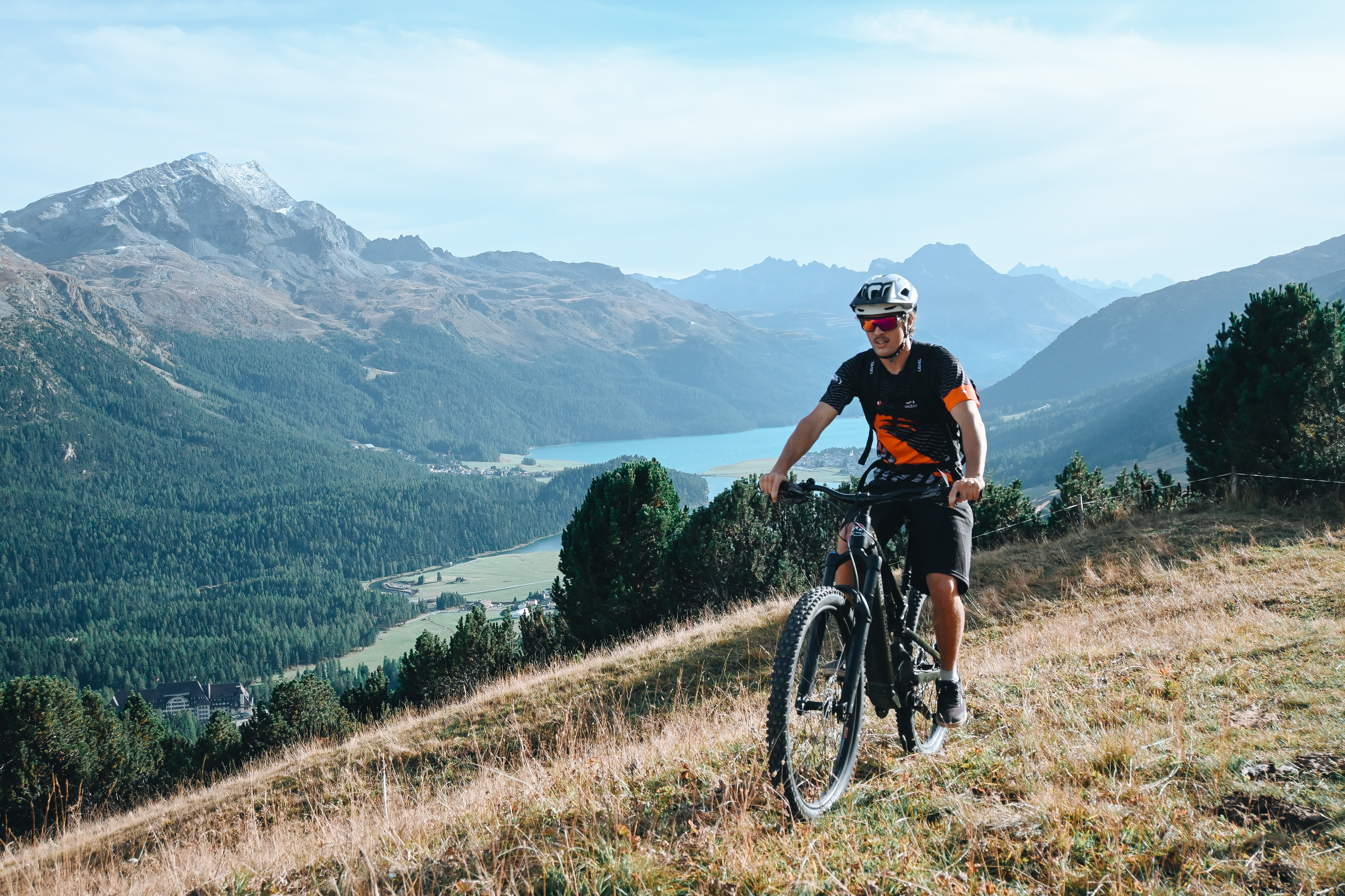 Mountainbiking with ski school St. Moritz with view of lake