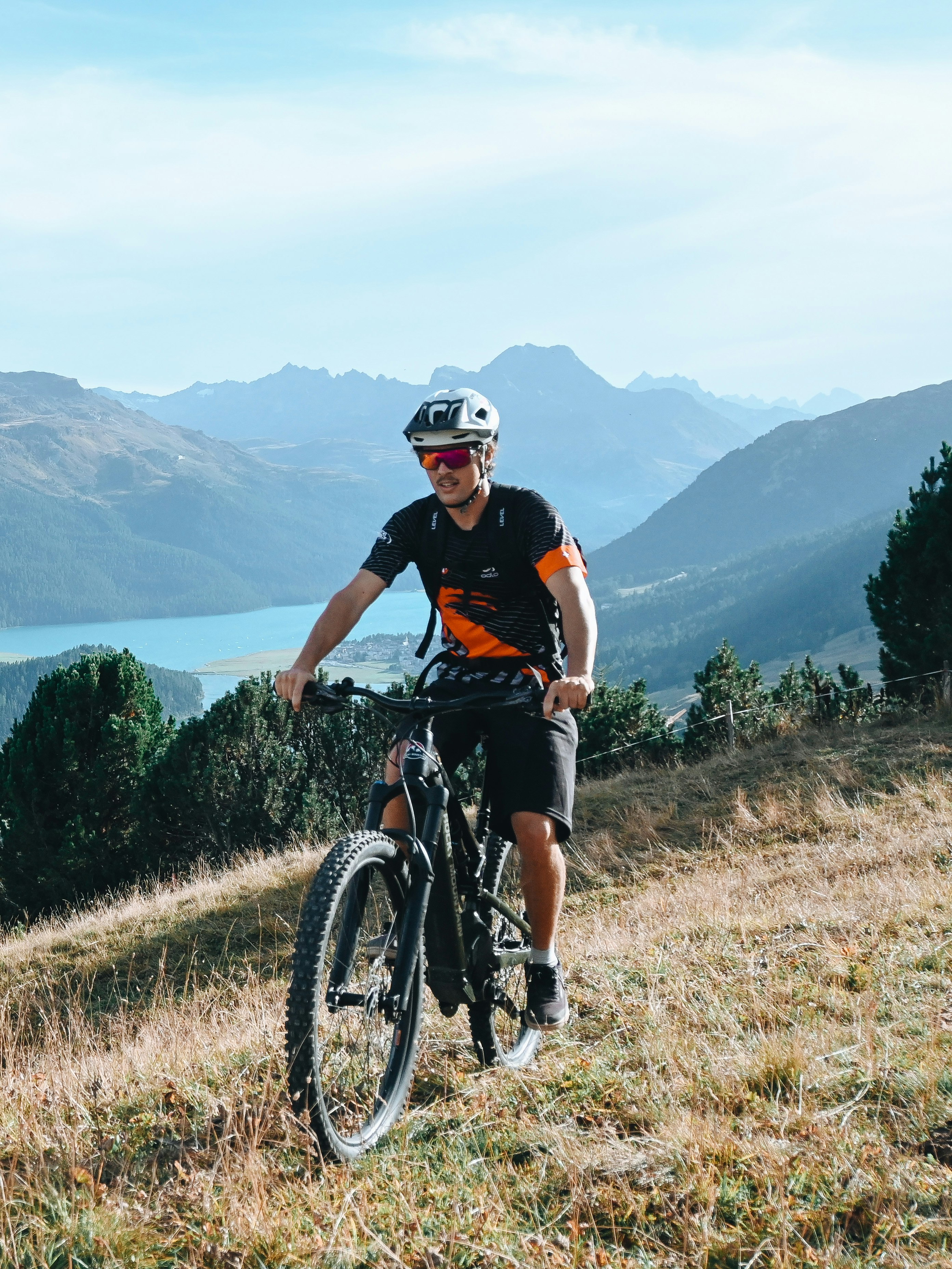 Mountainbiking with ski school St. Moritz with view of lake