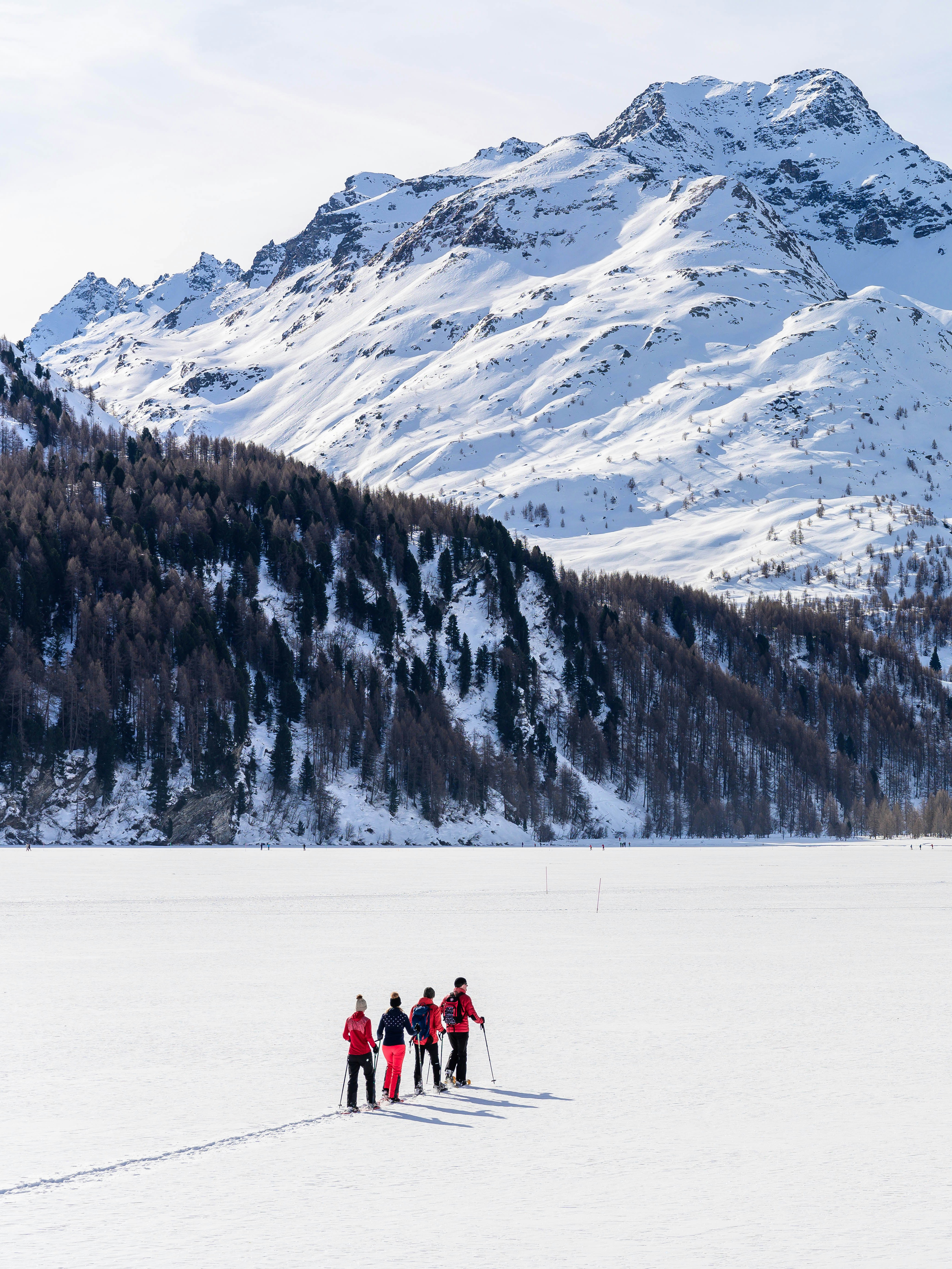 Snowshoe hike group on frozen lake