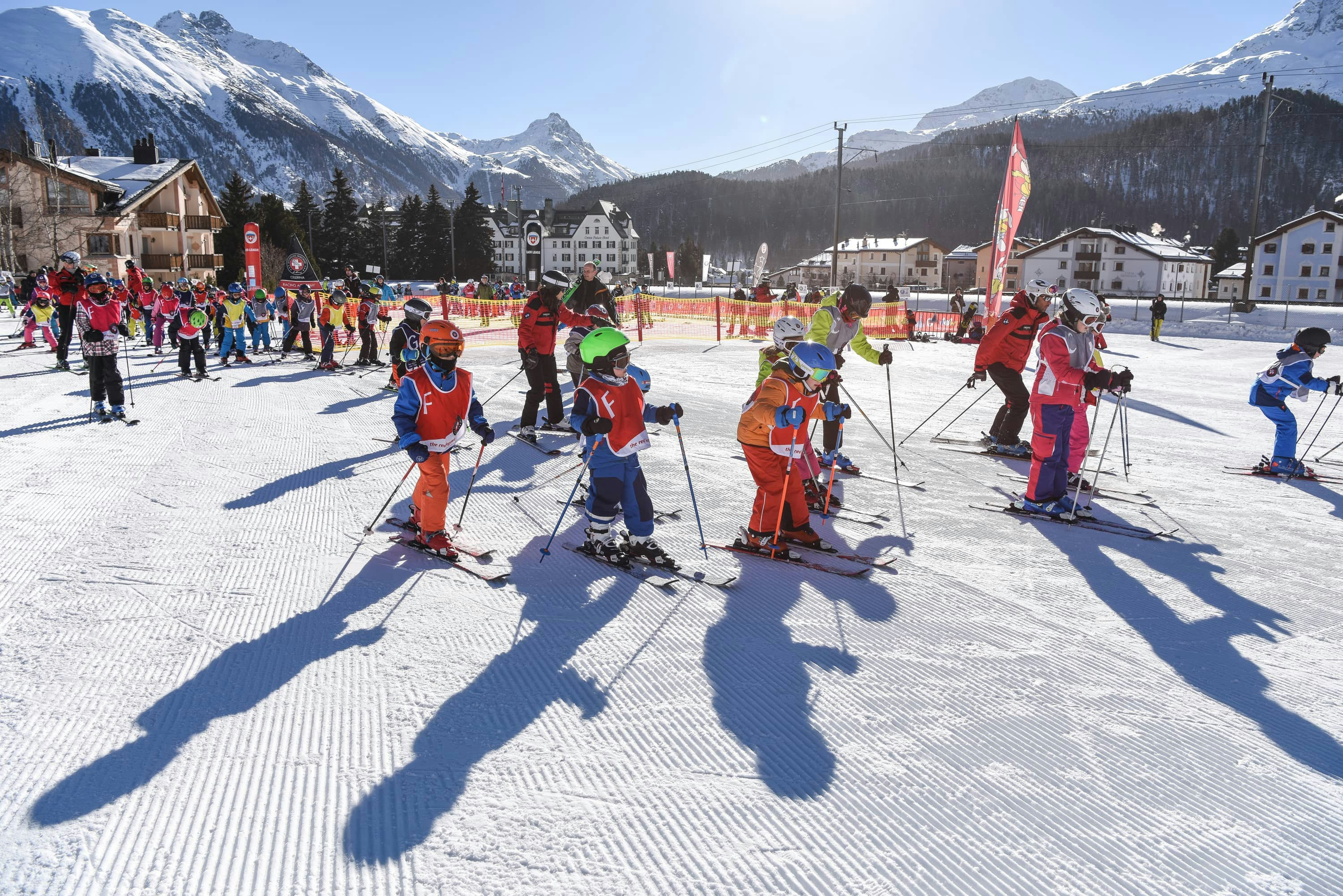 Ski class group children with ski school St. Moritz