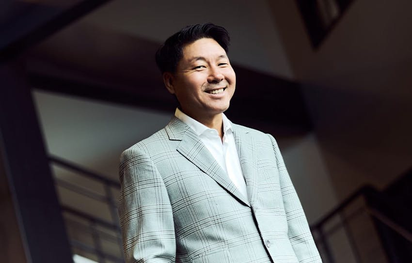 Rick Park smiling in suit