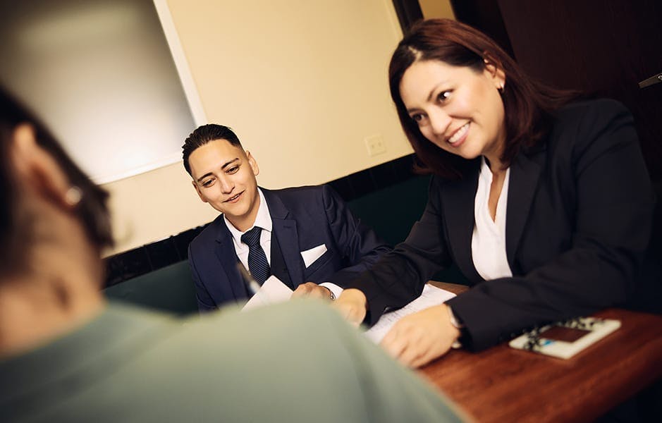 attorneys smiling at client