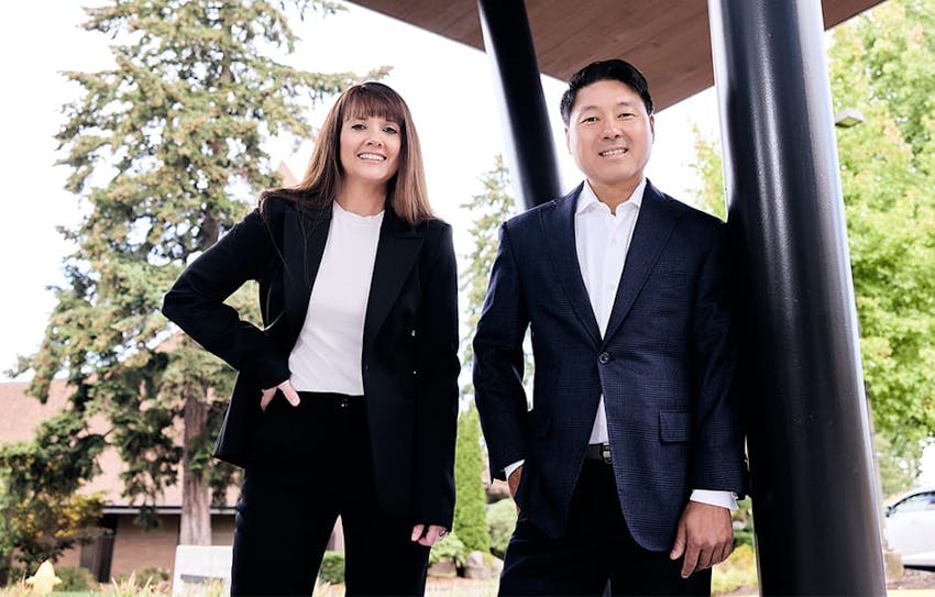 Rick and Angel in suits outdoors