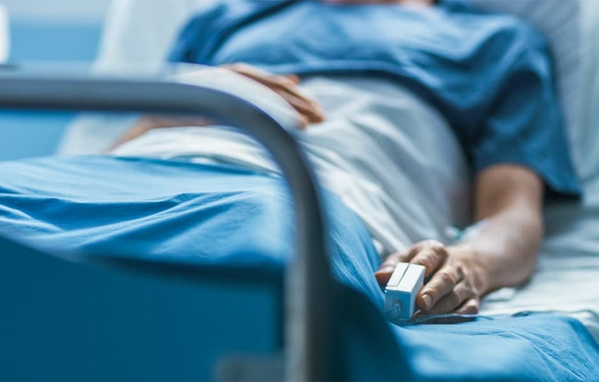 person in hospital bed