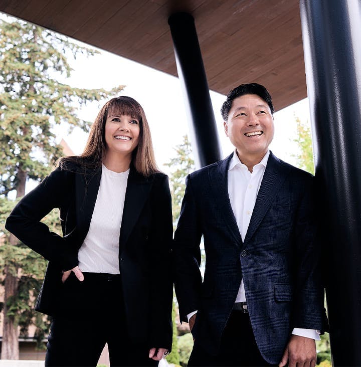 Rick Park and Angel Chenaur in suits outside