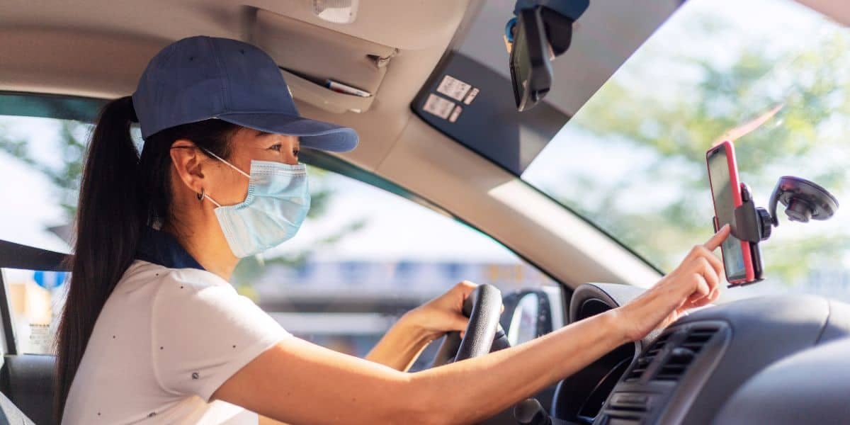 rideshare driver looking at map on phone