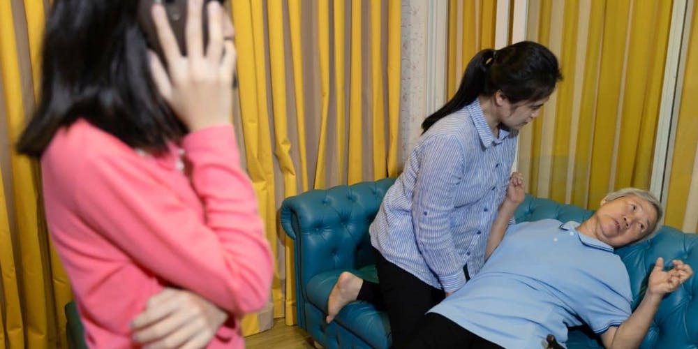 elder asian woman having a seizure