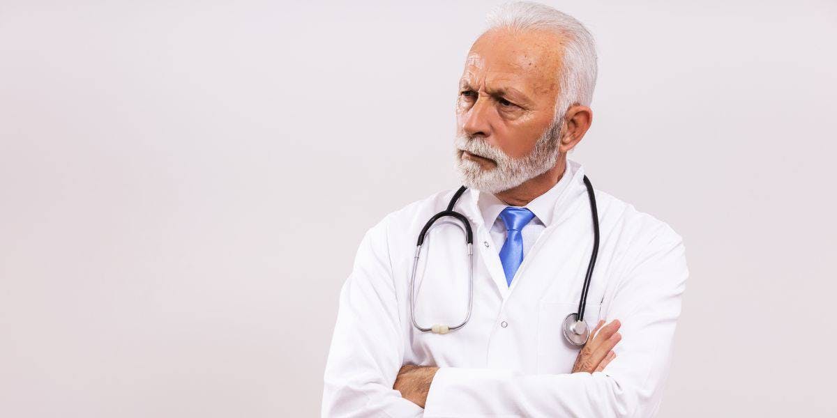 doctor with arms crossed depicting a medical malpractice concern