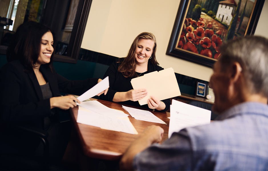 Attorneys helping a client