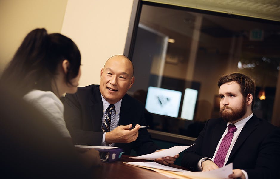 Attorneys helping a client