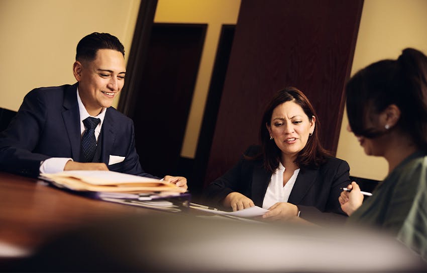 Attorneys helping a client