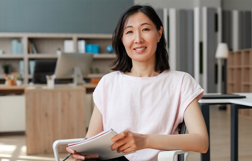 woman holding a notebook