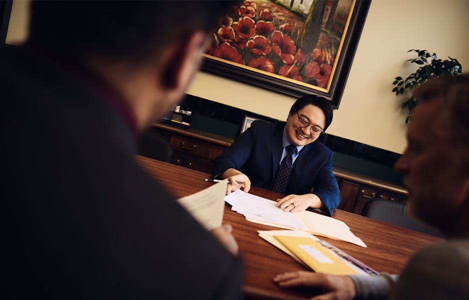 attorney smiling at table