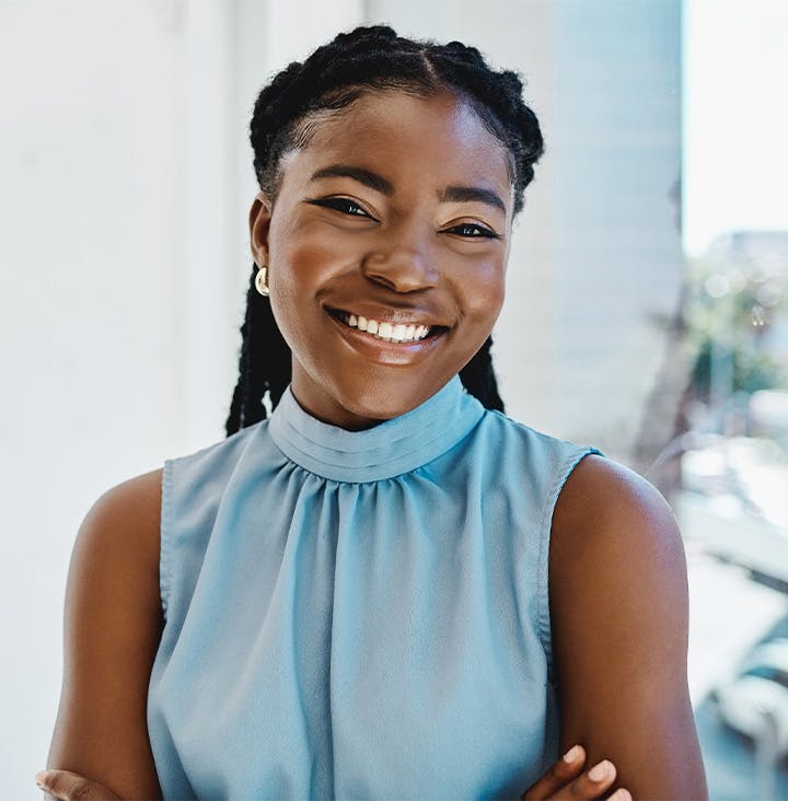 woman crossing her arms in blue shirt