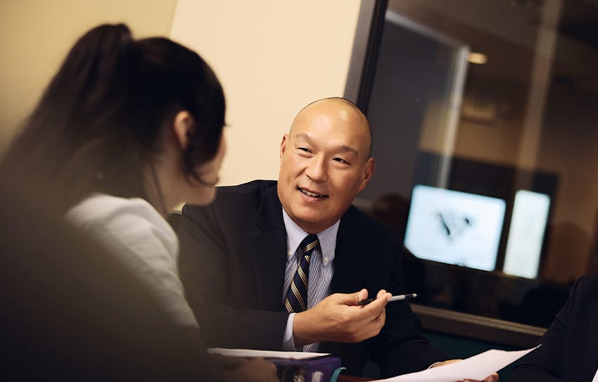 Marvin Lee speaking to client