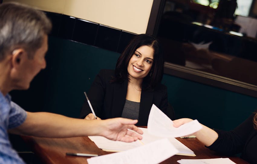 Liandra Tiller filling out paperwork with client