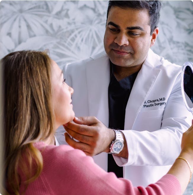 Dr. Chopra working with a patient