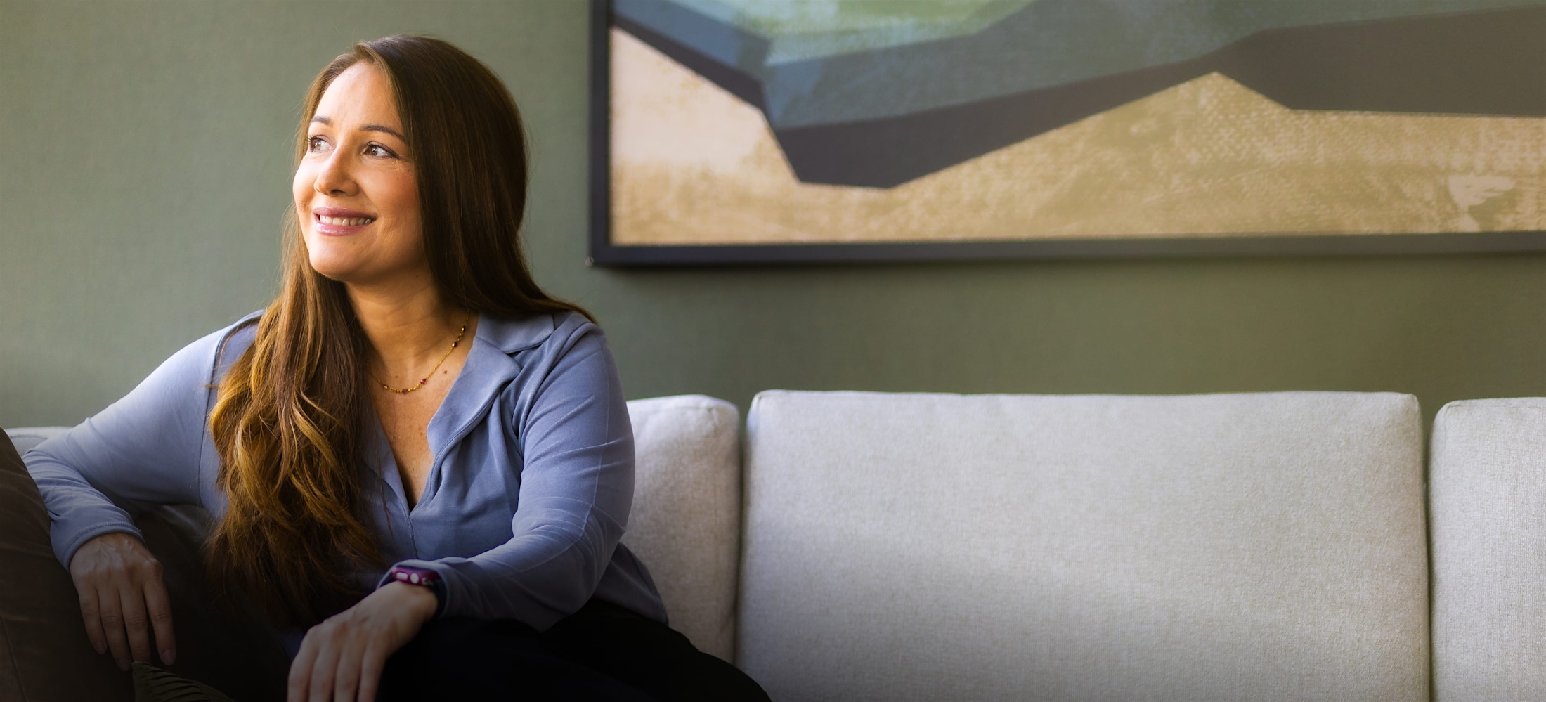 Woman smiling and looking to the side